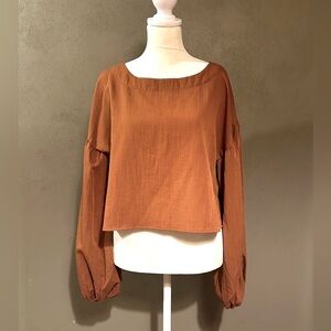 Rust crop long sleeve blouse with gathered cuffs, wide crew neck, NWT